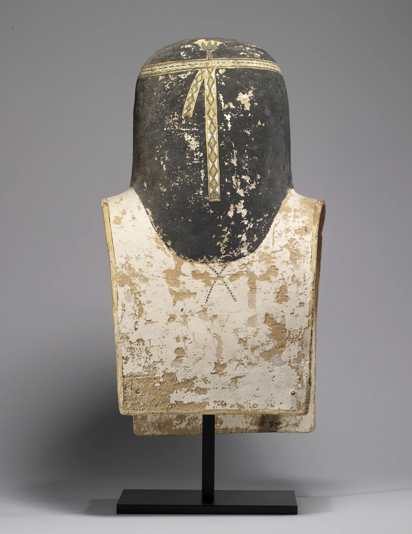 Back of an ancient Egyptian mummy mask showing material and repairs